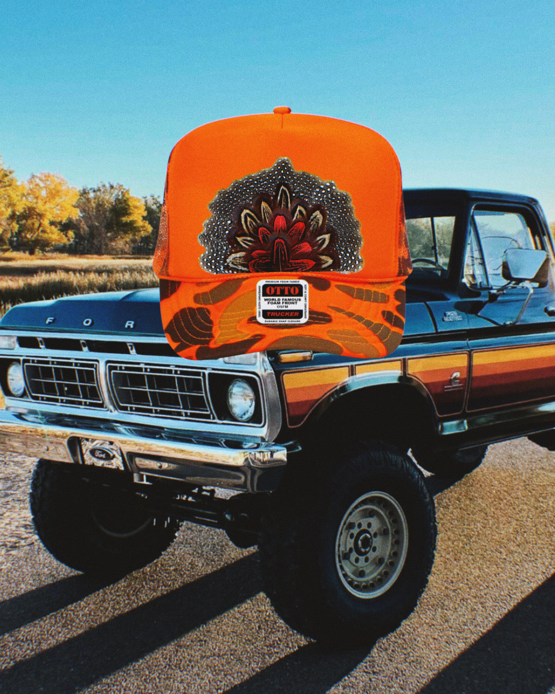Neon Orange Camo Feather Trucker Hat